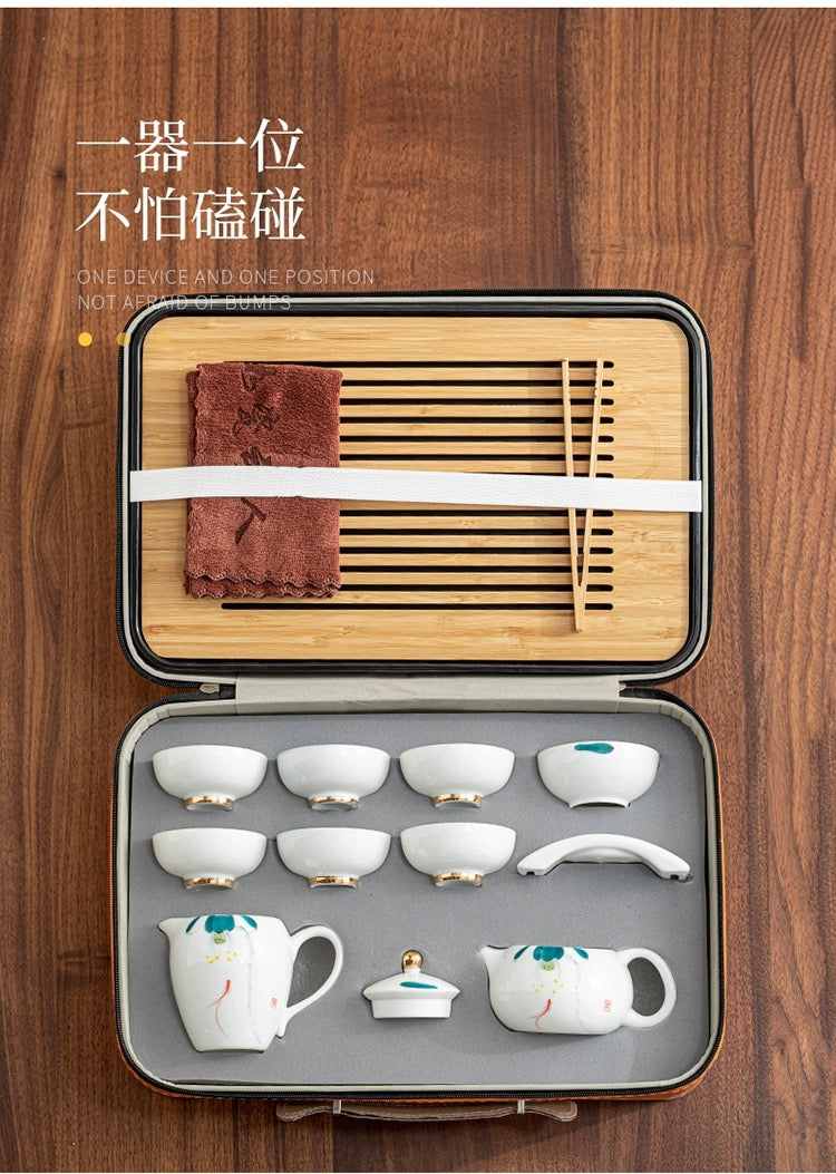 Portable china tea set with storage suitcase