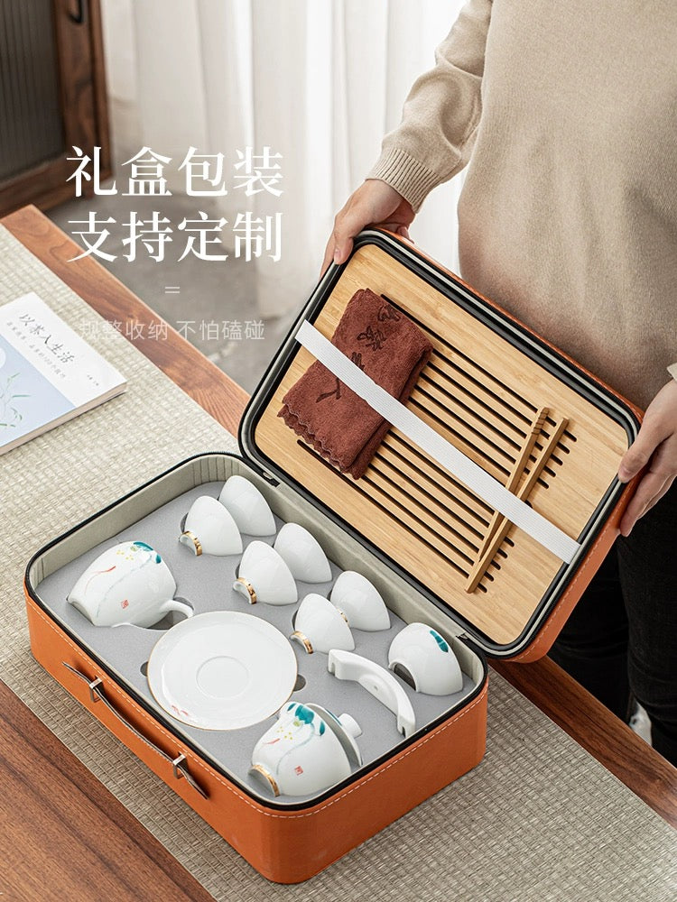 Portable china tea set with storage suitcase